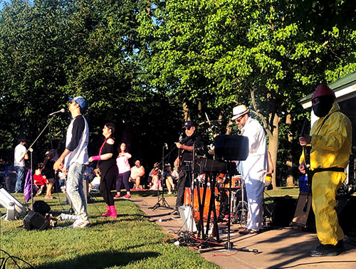 A local New Jersey band performs outside at the Little Falls Concert Series.